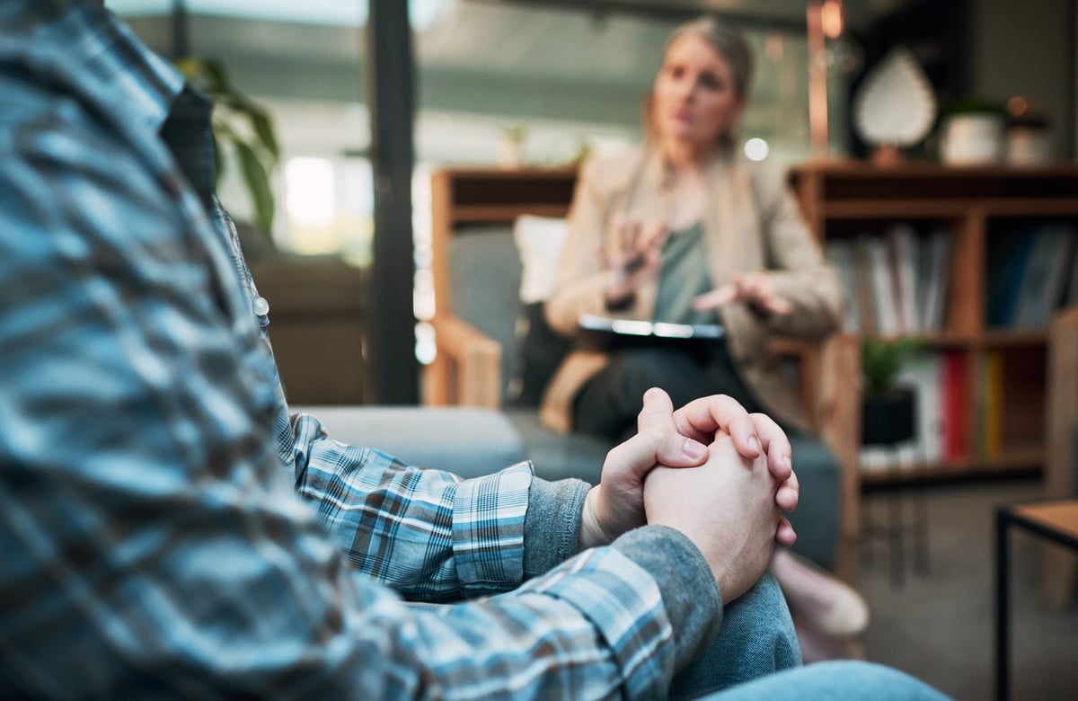 A man having a therapeutic session with a counselor
